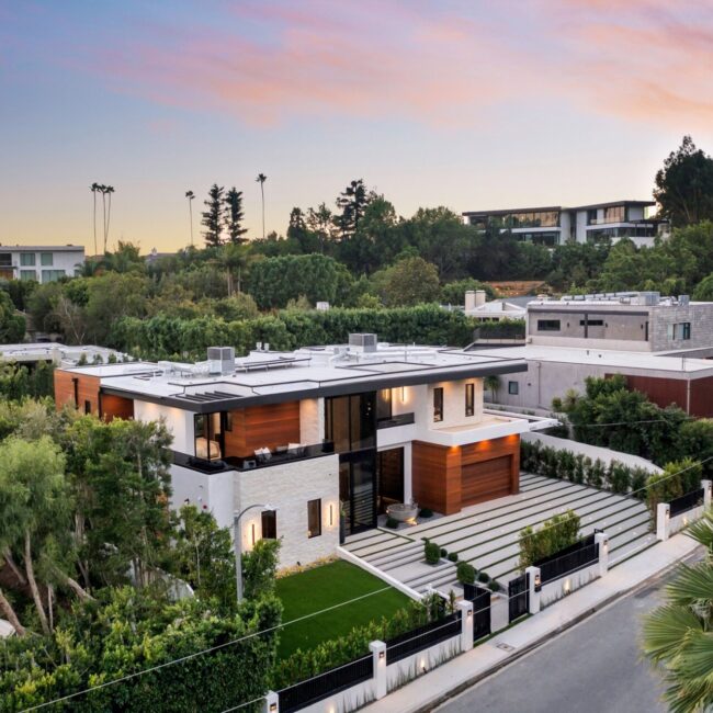 Modern luxury house aerial view at sunset