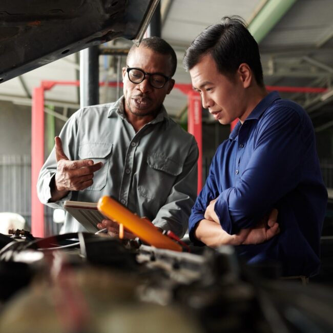 Car Mechanic Talking to Owner
